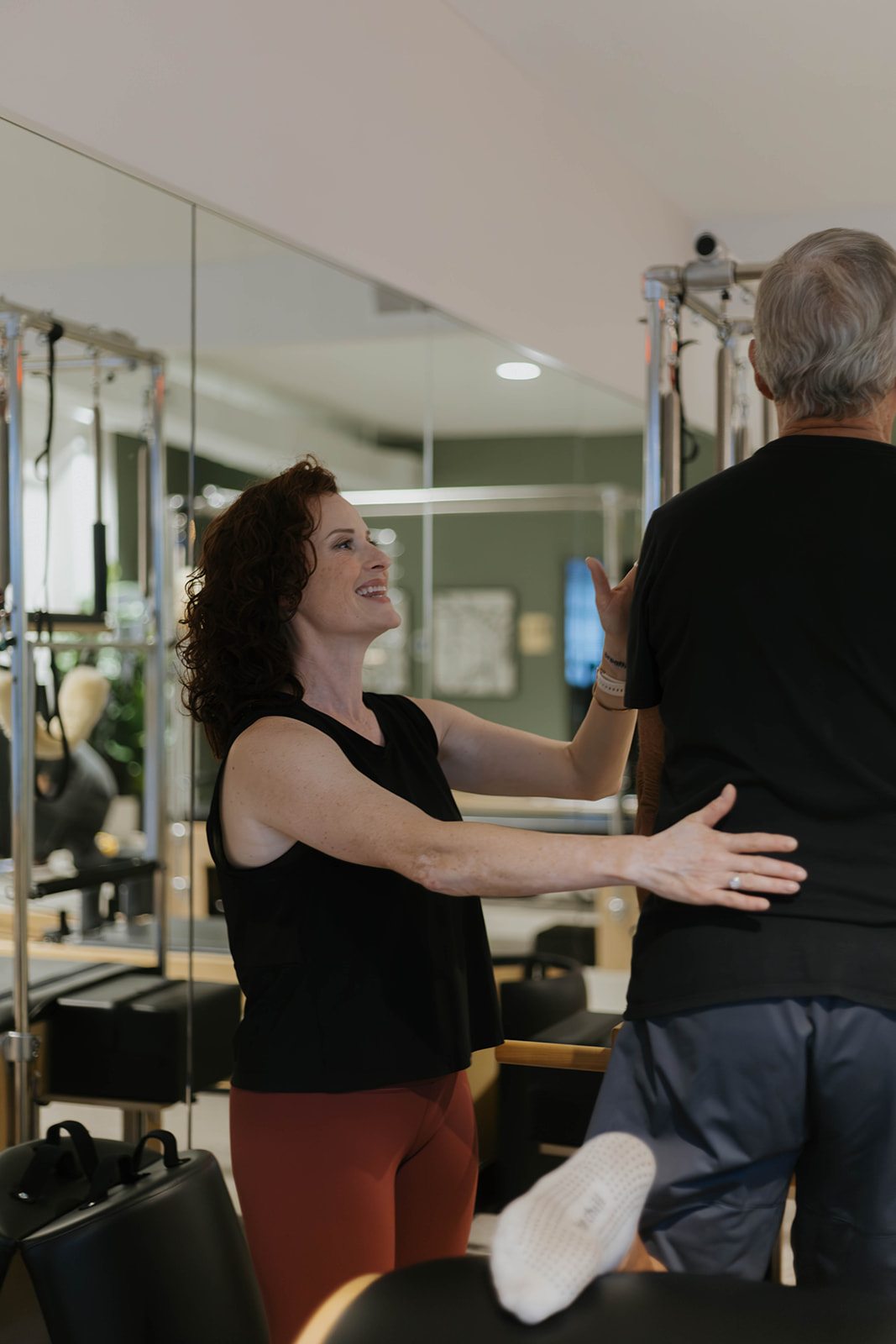 Jocelyn providing a tactile cue to a client